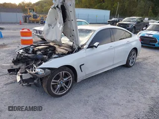 2015 BMW 4 Series 428i xDrive z VIN WBA4C9C57FD330866, wystawiony jako IAAI lot #40574326 z przebiegiem 123 726 mil mil oraz . Historia ofert i sprzedaży dostępna na DreamBid. Obrazek 2.