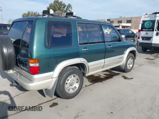 1996 Isuzu Trooper z VIN JACDJ58V4T7918002, wystawiony jako IAAI lot #41700255 z przebiegiem 203 951 mil mil oraz . Historia ofert i sprzedaży dostępna na DreamBid. Obrazek 4.