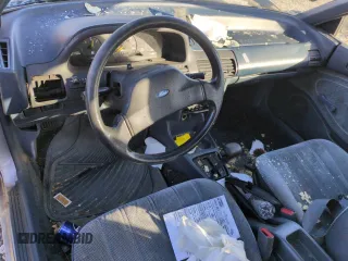 1993 Ford Escort z VIN 1FAPP15J7PW181838, wystawiony jako Copart lot #88717755 z przebiegiem 6 017 mil mil oraz Szkoda całkowita • Salvage title. Historia ofert i sprzedaży dostępna na DreamBid. Obrazek 8.