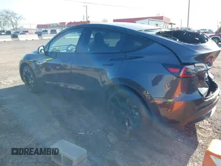 2021 Tesla Model Y Long Range with VIN 5YJYGAEE1MF149887, listed as a IAAI auction lot 42032104 with 54,932 mi miles. Bid and sale history available at carsss.com. Image 3.