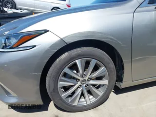 2021 Lexus ES 300h with VIN 58ACA1C1XMU007576, listed as a IAAI auction lot 42302934 with 24,614 mi miles and . Bid and sale history available at DreamBid. Image 6.
