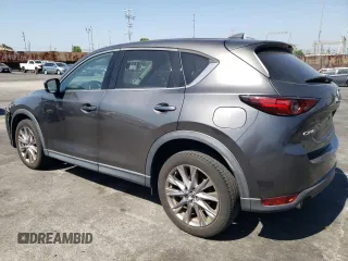 2019 Mazda CX-5 Grand Touring with VIN JM3KFADM6K1641992, listed as a Copart auction lot 57862345 with 37,100 mi miles and Salvage title. Bid and sale history available at DreamBid. Image 2.