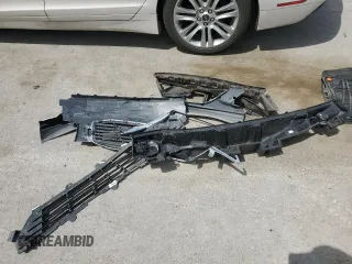 2014 Lincoln MKZ Hybrid z VIN 3LN6L2LU2ER816576, wystawiony jako Copart lot #57030235 z przebiegiem 221 863 mil mil oraz Szkoda całkowita • Salvage title. Historia ofert i sprzedaży dostępna na DreamBid. Obrazek 12.