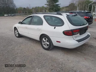 2003 Ford Taurus SE z VIN 1FAFP58S63A158422, wystawiony jako IAAI lot #41933813 z przebiegiem 71 990 mil mil oraz . Historia ofert i sprzedaży dostępna na DreamBid. Obrazek 3.