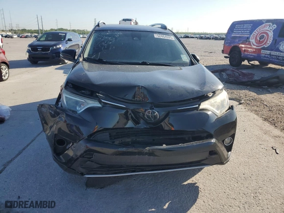 2018 Toyota RAV4 XLE with VIN 2T3WFREV2JW472232, listed as a Copart auction lot 52464025 with 131,421 mi miles and Salvage Title. Bid and sale history available at carsss.com. Image 5.