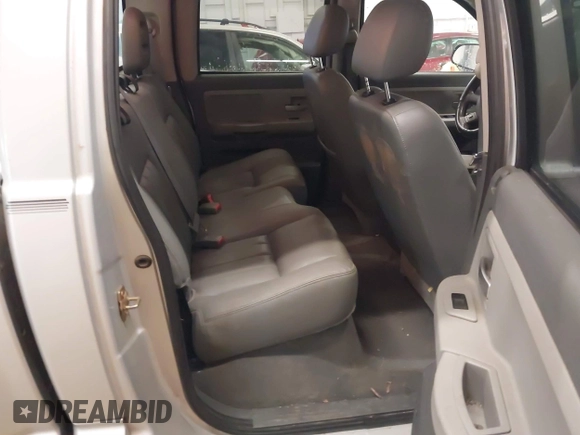 2005 Dodge Dakota Laramie with VIN 1D7HW58N75S188127, listed as a IAAI auction lot 41209206 with 117,480 mi miles and . Bid and sale history available at DreamBid. Image 8.