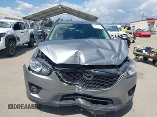 2014 Mazda CX-5 Touring z VIN JM3KE2CYXE0322943, wystawiony jako IAAI lot #41934670 z przebiegiem 110 690 mil mil oraz . Historia ofert i sprzedaży dostępna na DreamBid. Obrazek 12.