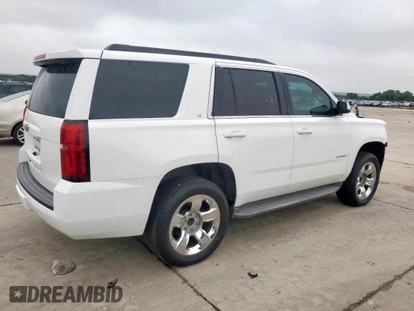 2015 Chevrolet Tahoe LT with VIN 1GNSCBKC0FR210211, listed as a Copart auction lot 55496995 with 128,296 mi miles and Salvage title. Bid and sale history available at DreamBid. Image 3.