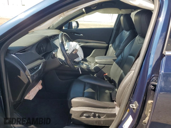 2019 Cadillac XT4 FWD Premium Luxury with VIN 1GYFZCR42KF104457, listed as a Copart auction lot 52783485 with 57,572 mi miles and Salvage title. Bid and sale history available at DreamBid. Image 7.