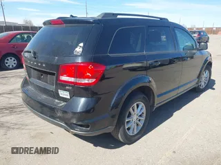 2016 Dodge Journey SXT with VIN 3C4PDDBG3GT215910, listed as a IAAI auction lot 41798779 with 165,505 mi miles. Bid and sale history available at carsss.com. Image 4.