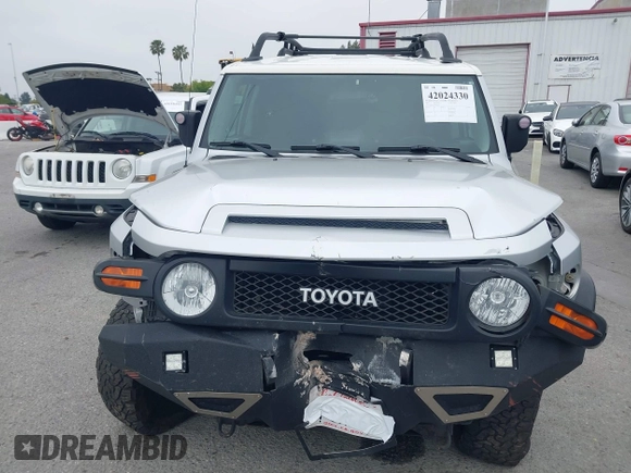 2007 Toyota FJ Cruiser with VIN JTEBU11F370036941, listed as a IAAI auction lot 42024330 with 164,703 mi miles. Bid and sale history available at carsss.com. Image 12.