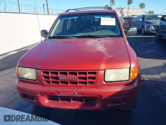 1999 Isuzu Rodeo S z VIN 4S2CK58W3X4307201, wystawiony jako IAAI lot #41884901 z przebiegiem 236 970 mil mil oraz . Historia ofert i sprzedaży dostępna na DreamBid. Obrazek 6.