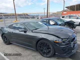2018 Ford Mustang EcoBoost z VIN 1FA6P8THXJ5154523, wystawiony jako IAAI lot #41523923 z przebiegiem 94 330 mil mil oraz . Historia ofert i sprzedaży dostępna na DreamBid. Obrazek 13.