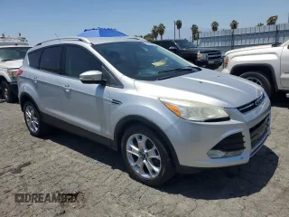 2015 Ford Escape Titanium with VIN 1FMCU0JX3FUB81735, listed as a Copart auction lot 61622995 with 154,932 mi miles and Clean title. Bid and sale history available at DreamBid. Image 4.