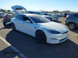 2022 Tesla Model S Plaid with VIN 5YJSA1E64NF479959, listed as a IAAI auction lot 41057673 with 27,203 mi miles and . Bid and sale history available at carsss.com. Image 1.