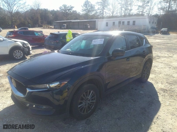 2019 Mazda CX-5 Touring with VIN JM3KFBCM5K0633668, listed as a IAAI auction lot 41617142 with 57,809 mi miles. Bid and sale history available at carsss.com. Image 2.