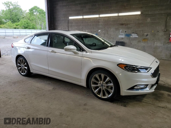 2017 Ford Fusion Titanium with VIN 3FA6P0D99HR138992, listed as a Copart auction lot 58421995 with 24,057 mi miles and Salvage title. Bid and sale history available at DreamBid. Image 4.