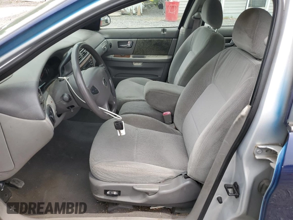 2003 Mercury Sable GS z VIN 1MEFM50U83G602556, wystawiony jako Copart lot #61019515 z przebiegiem 94 998 mil mil oraz Czysty tytuł • Clean title. Historia ofert i sprzedaży dostępna na DreamBid. Obrazek 7.