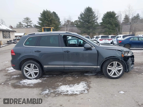 2012 Volkswagen Touareg Sport z VIN WVGEF9BP4CD008517, wystawiony jako IAAI lot #41386971 z przebiegiem 179 306 mil mil oraz . Historia ofert i sprzedaży dostępna na DreamBid. Obrazek 13.