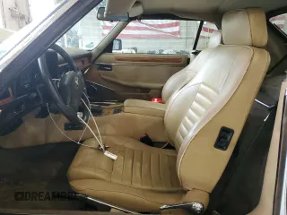 1989 Jaguar XJS z VIN SAJNV4847KC151989, wystawiony jako Copart lot #61401054 z przebiegiem 80 570 mil mil oraz Szkody całkowita. Historia ofert i sprzedaży dostępna na DreamBid. Obrazek 7.