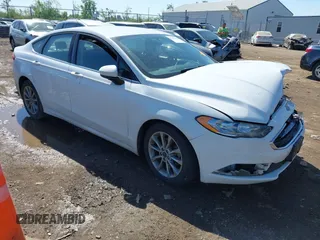 2017 Ford Fusion SE z VIN 3FA6P0H7XHR415299, wystawiony jako IAAI lot #42232634 z przebiegiem 107 962 mil mil oraz . Historia ofert i sprzedaży dostępna na DreamBid. Obrazek 1.