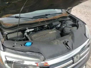 2018 Honda Pilot Touring z VIN 5FNYF5H99JB025824, wystawiony jako Copart lot #67891215 z przebiegiem 64 982 mil mil oraz Szkoda całkowita • Salvage title. Historia ofert i sprzedaży dostępna na DreamBid. Obrazek 16.