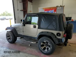 2003 Jeep Wrangler Sport z VIN 1J4FA49S23P303662, wystawiony jako Copart lot #60335135 z przebiegiem 158 490 mil mil oraz Czysty tytuł • Clean title. Historia ofert i sprzedaży dostępna na DreamBid. Obrazek 2.