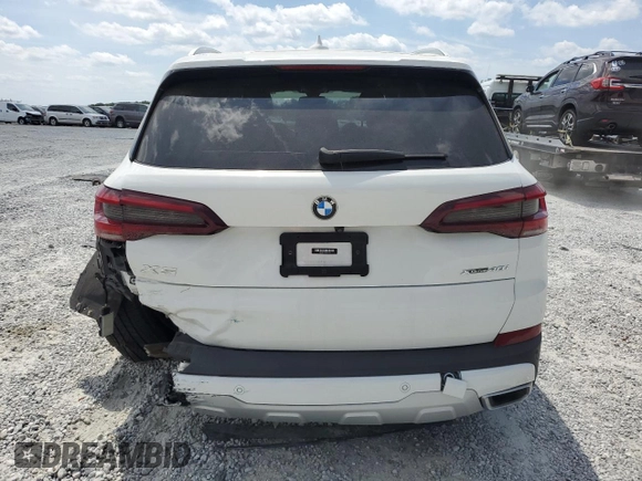 2021 BMW X5 xDrive40i z VIN 5UXCR6C07M9H21128, wystawiony jako Copart lot #54084915 z przebiegiem 26 966 mil mil oraz Szkody całkowita. Historia ofert i sprzedaży dostępna na DreamBid. Obrazek 6.
