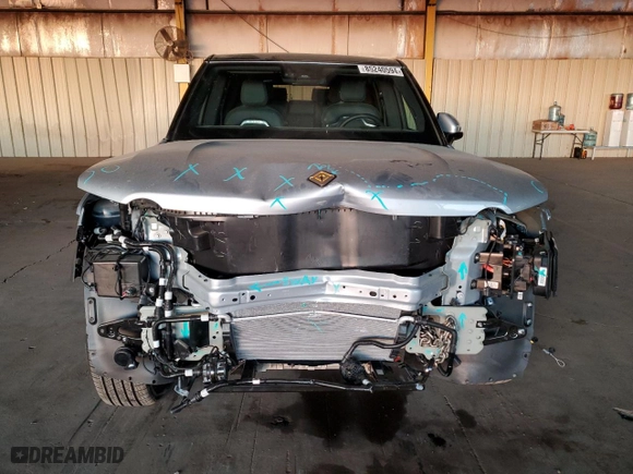2025 Rivian R1S Adventure with VIN 7PDSGBBA4SN052199, listed as a Copart auction lot 85240594 with 173 mi miles and Salvage Title. Bid and sale history available at carsss.com. Image 5.