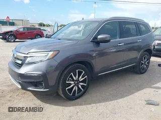 2022 Honda Pilot Elite with VIN 5FNYF6H04NB025212, listed as a IAAI auction lot 42430032 with 69,427 mi miles and . Bid and sale history available at DreamBid. Image 2.