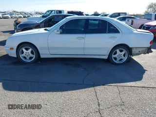 2002 Mercedes-Benz E-Class with VIN WDBJF82J62X076581, listed as a IAAI auction lot 41194976 with 235,453 mi miles. Bid and sale history available at carsss.com. Image 14.