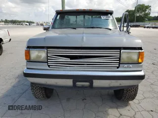 1989 Ford F-150 with VIN 1FTEF14H5KNB08484, listed as a Copart auction lot 57740504 with 69,414 mi miles and Salvage Title. Bid and sale history available at carsss.com. Image 5.