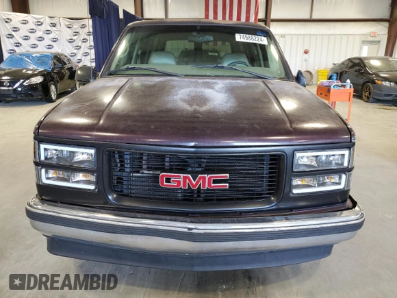 1997 GMC Yukon with VIN 1GKEC13R2VJ734299, listed as a Copart auction lot 74988224 with 225,335 mi miles and Salvage Title. Bid and sale history available at carsss.com. Image 5.