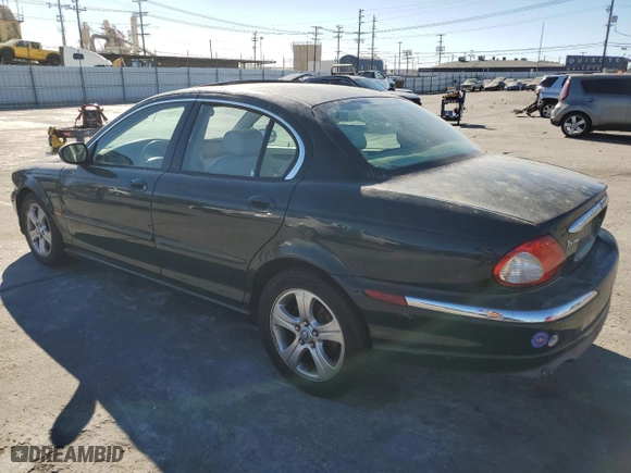 2002 Jaguar X-Type with VIN SAJEA51C12WC33477, listed as a Copart auction lot 83711124 with 165,637 mi miles and Salvage Title. Bid and sale history available at carsss.com. Image 2.