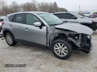 2015 Mazda CX-5 Sport with VIN JM3KE4BEXF0499688, listed as a Copart auction lot 88988095 with 258,460 mi miles and Salvage title. Bid and sale history available at DreamBid. Image 4.