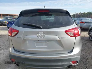 2015 Mazda CX-5 Touring with VIN JM3KE2CYXF0435583, listed as a IAAI auction lot 41737810 with 107,270 mi miles and . Bid and sale history available at DreamBid. Image 16.