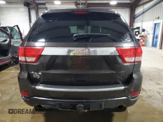2013 Jeep Grand Cherokee Overland with VIN 1C4RJFCT7DC587329, listed as a Copart auction lot 53432625 with 98,938 mi miles and Salvage Title. Bid and sale history available at carsss.com. Image 6.