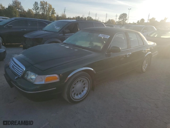 2000 Ford Crown Victoria LX with VIN 2FAFP74W9YX146624, listed as a Copart auction lot 77495074 with 167,594 mi miles and Salvage Title. Bid and sale history available at carsss.com. Image 1.