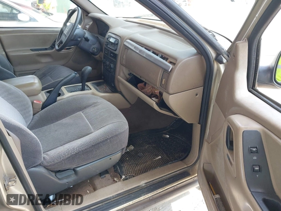 2001 Jeep Grand Cherokee Laredo with VIN 1J4GX48S81C589400, listed as a IAAI auction lot 42091559 with 219,698 mi miles and . Bid and sale history available at DreamBid. Image 5.