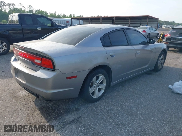 2014 Dodge Charger SE with VIN 2C3CDXBGXEH284832, listed as a IAAI auction lot 42069294 with 186,273 mi miles and . Bid and sale history available at carsss.com. Image 4.