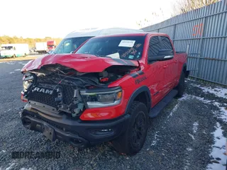2021 Ram 1500 Rebel with VIN 1C6SRFLT2MN591844, listed as a IAAI auction lot 40410248 with 84,759 mi miles and . Bid and sale history available at DreamBid. Image 2.