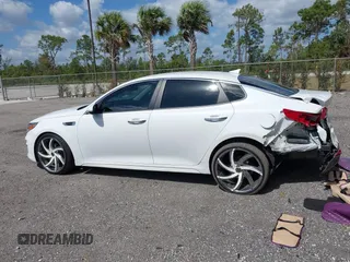 2018 Kia Optima LX z VIN 5XXGT4L39JG272694, wystawiony jako IAAI lot #42155363 z przebiegiem 115 417 mil mil oraz . Historia ofert i sprzedaży dostępna na DreamBid. Obrazek 14.