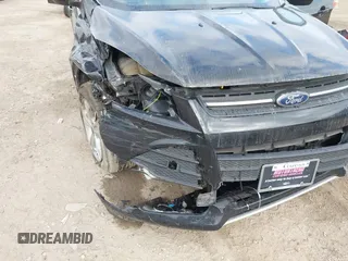 2014 Ford Escape SE z VIN 1FMCU9G9XEUA15367, wystawiony jako IAAI lot #42358528 z przebiegiem 145 994 mil mil oraz . Historia ofert i sprzedaży dostępna na DreamBid. Obrazek 6.