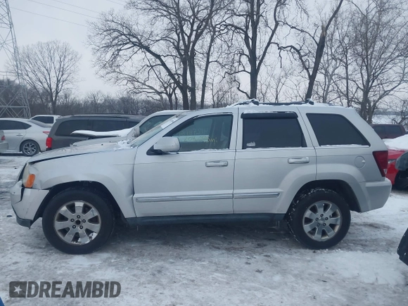 2008 Jeep Grand Cherokee with VIN 1J8HS58M58C117397, listed as a IAAI auction lot 41298484 with 208,095 mi miles and . Bid and sale history available at DreamBid. Image 14.