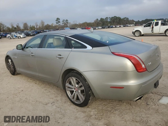 2014 Jaguar XJ with VIN SAJWA2GZ8E8V60138, listed as a Copart auction lot 86384064 with 137,190 mi miles and Salvage Title. Bid and sale history available at carsss.com. Image 2.