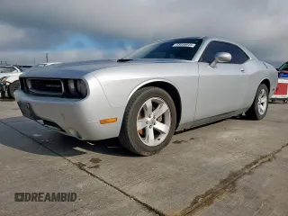 2012 Dodge Challenger SXT Plus z VIN 2C3CDYAGXCH124857, wystawiony jako Copart lot #58558045 z przebiegiem 188 345 mil mil oraz Czysty tytuł • Clean title. Historia ofert i sprzedaży dostępna na DreamBid. Obrazek 1.