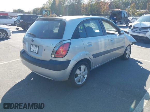 2009 Kia Rio LX with VIN KNADE243696547512, listed as a IAAI auction lot 40639932 with 204,809 mi miles. Bid and sale history available at carsss.com. Image 4.