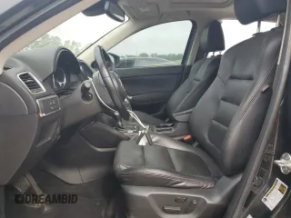 2016 Mazda CX-5 Grand Touring z VIN JM3KE2DY5G0676290, wystawiony jako Copart lot #54155325 z przebiegiem 124 743 mil mil oraz Szkoda całkowita • Salvage title. Historia ofert i sprzedaży dostępna na DreamBid. Obrazek 7.