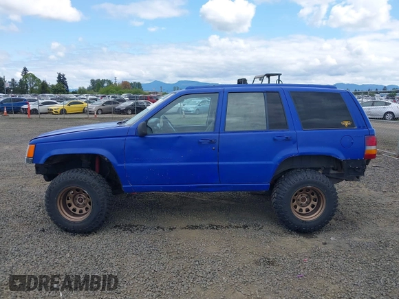 1996 Jeep Grand Cherokee Laredo with VIN 1J4GZ58YXTC329037, listed as a IAAI auction lot 42051175 with 314,571 mi miles and . Bid and sale history available at DreamBid. Image 14.