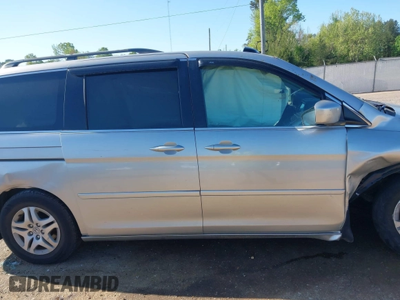 2005 Honda Odyssey EX-L z VIN 5FNRL38715B014905, wystawiony jako IAAI lot #41986395 z przebiegiem 191 029 mil mil oraz . Historia ofert i sprzedaży dostępna na DreamBid. Obrazek 13.